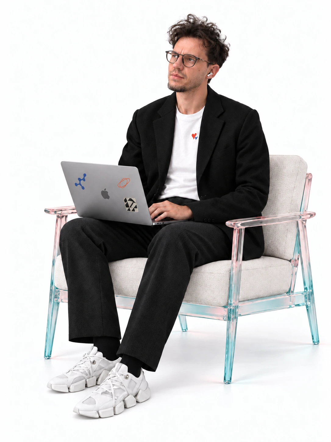 Yura relaxing with a laptop, looking toward the studio’s words.
